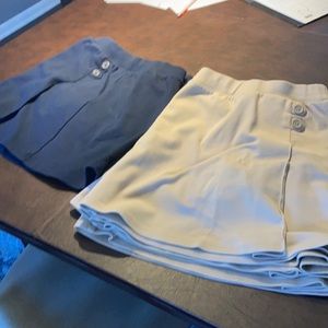 5 tan and 2 navy school skirts.  Built in shorts, cotton/ poly blend.